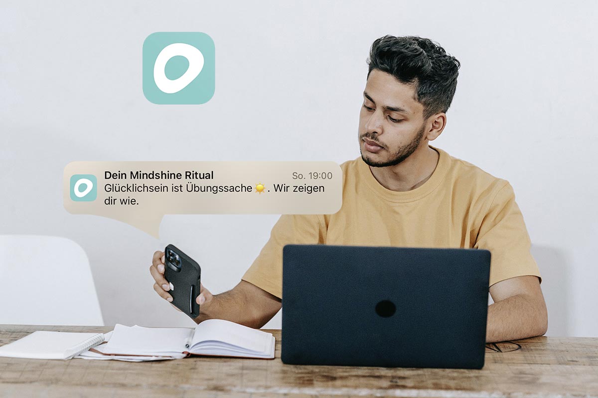 Mann bekommt Mindshine Benachrichtigung auf sein Handy