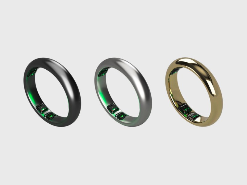 Drei Modelle der Iris Smart Ringe vor einem grauen Hintergrund.