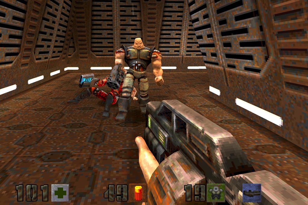 Screenshot vom Ego-Shooter Quake 2. Das Bild zeigt eine moderne Shotgun und einen Gegner, der auf das Bild zuläuft.