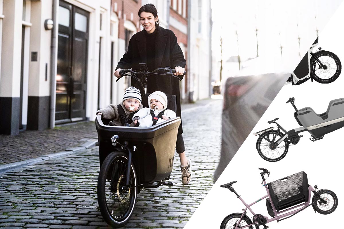 Frau auf einem E-Cargo-Bike auf einer Straße.